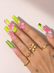 Pink Canopy long square press-on nails worn on hand