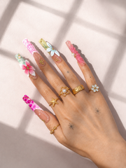 Seaside Bloom long square press-on nails worn on hand
