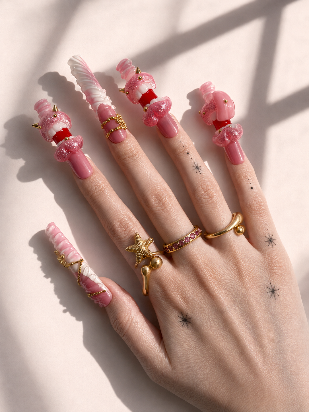 Pink Fang long square press-on nails worn on hand