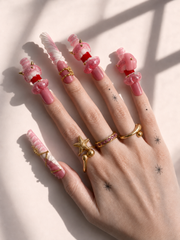 Pink Fang long square press-on nails worn on hand