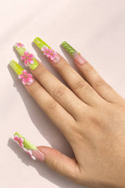 Pink Canopy long square press-on nails worn on hand