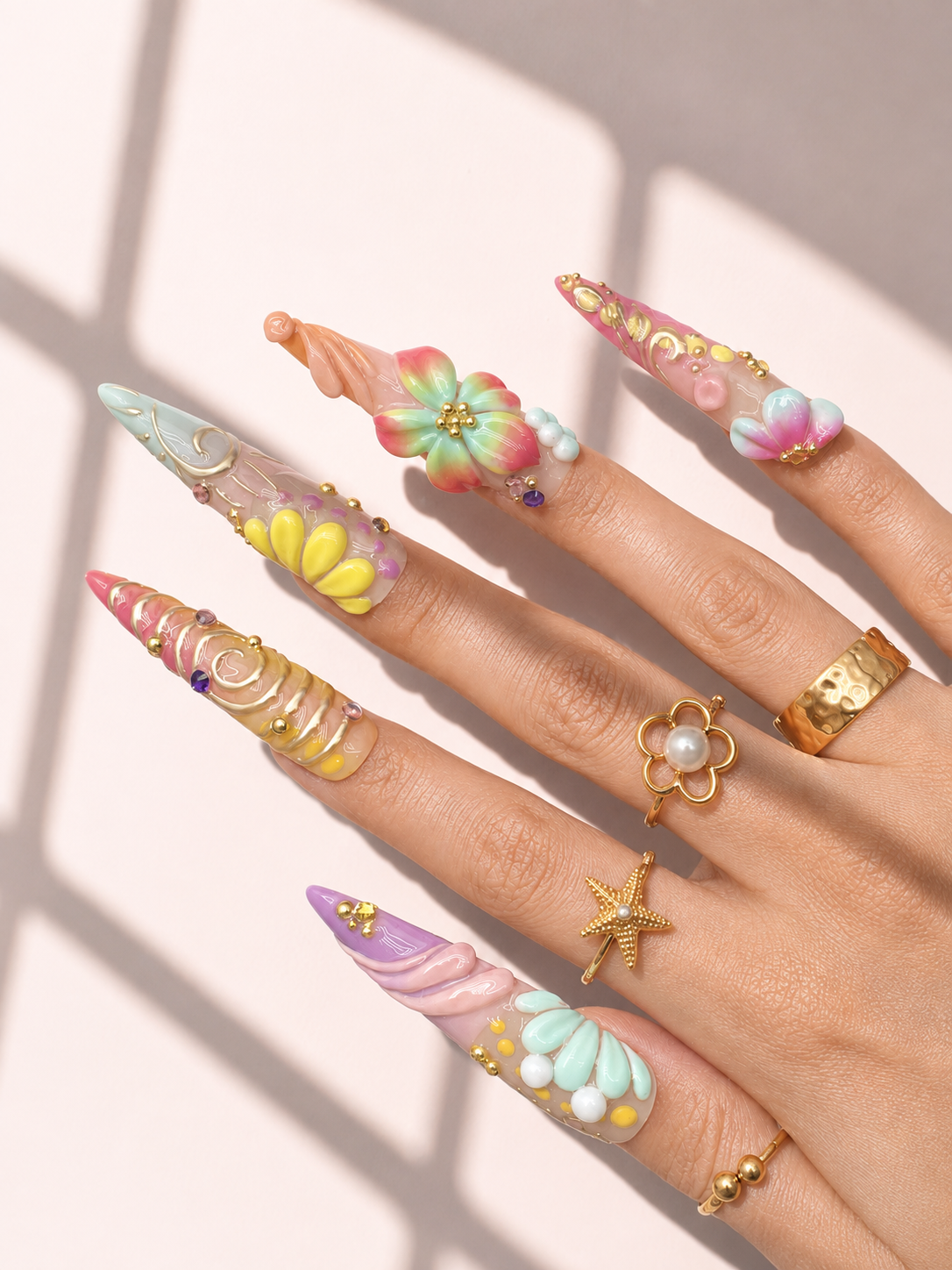 Pastel Current stiletto press-on nails worn on hand