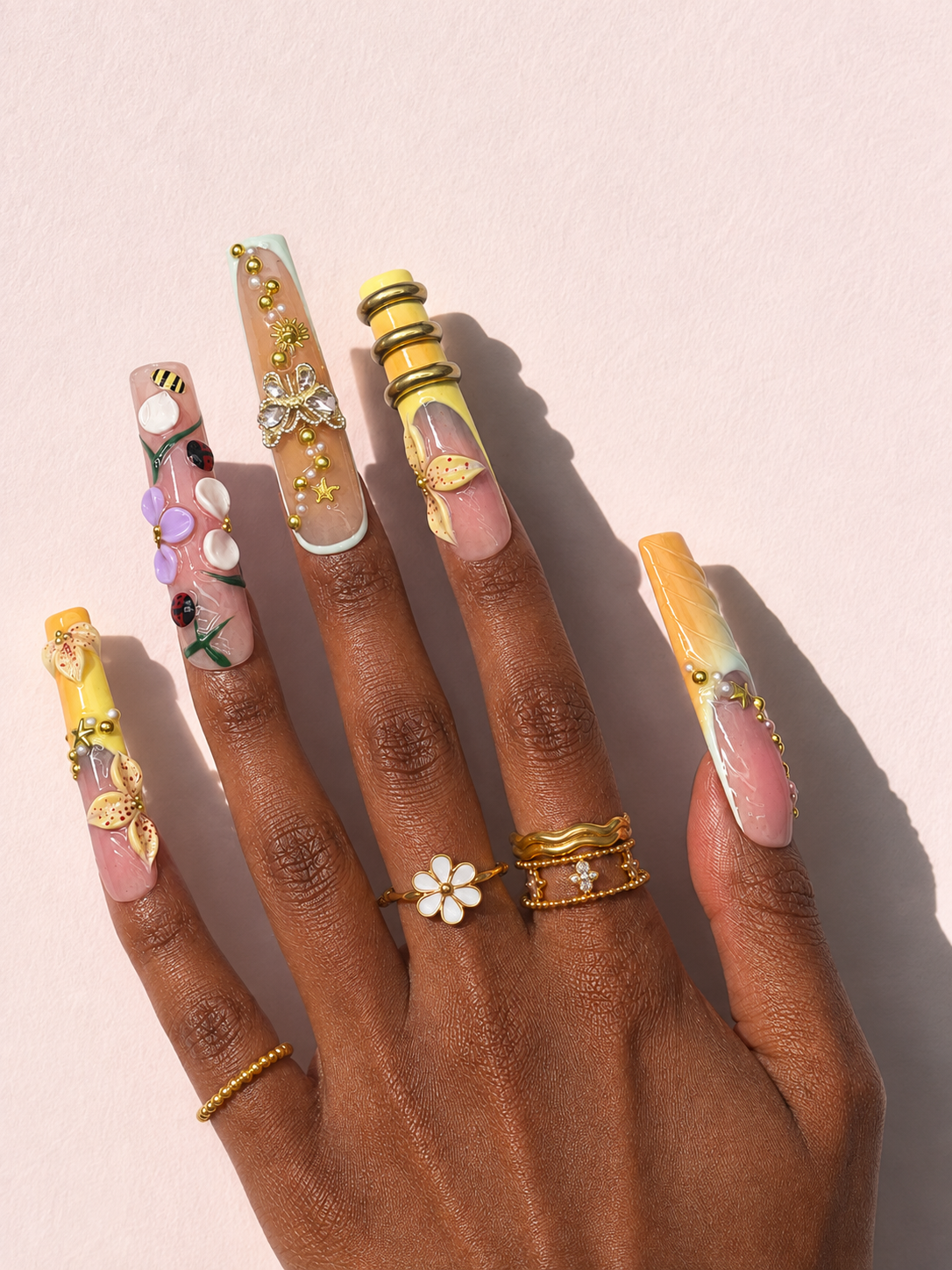 Honeyed Orbit long square press-on nails worn on hand