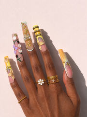 Honeyed Orbit long square press-on nails worn on hand