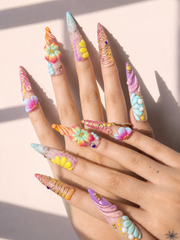 Pastel Current stiletto press-on nails worn on hand