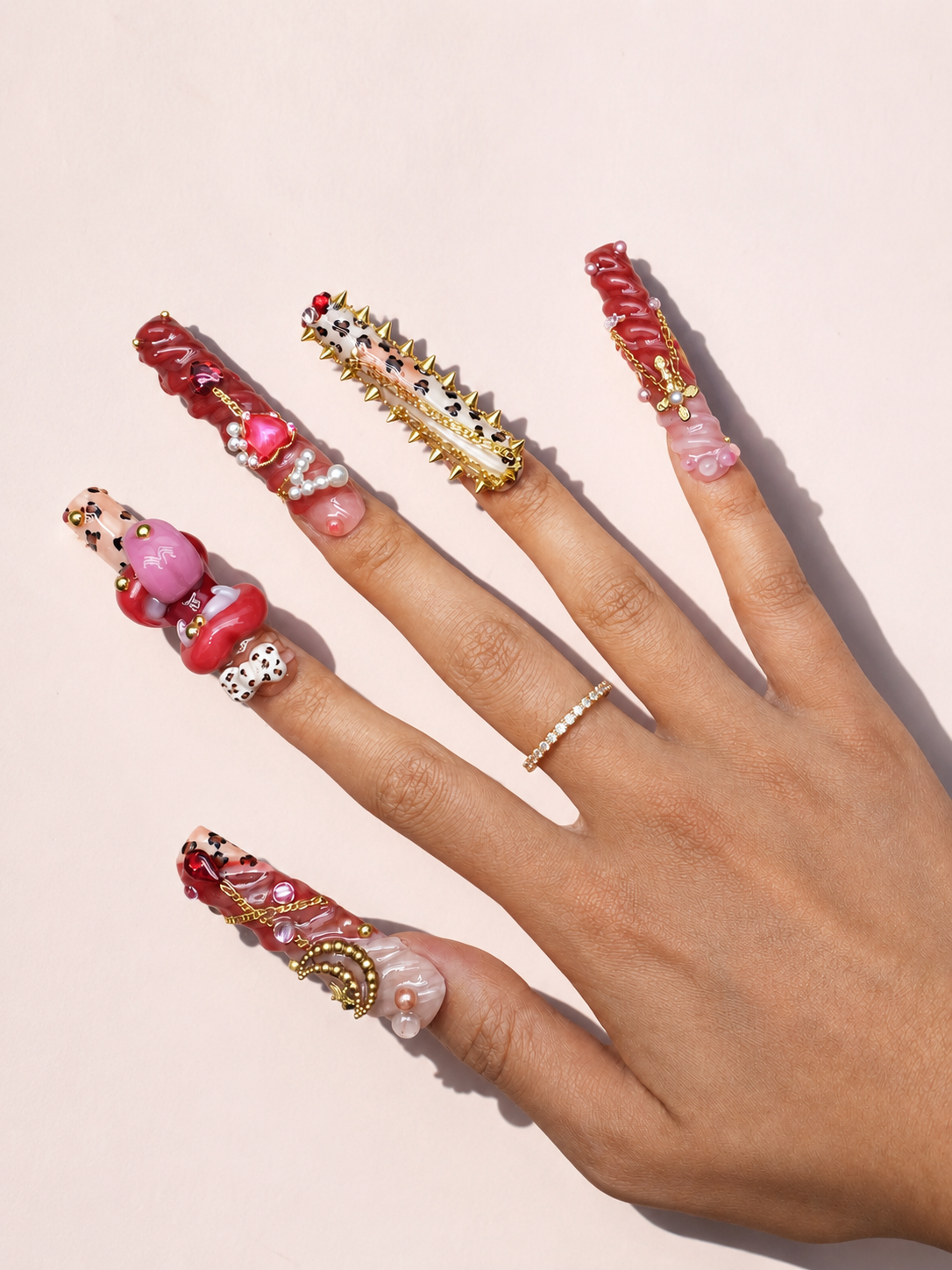 Scarlet Riot long square press-on nails worn on hand