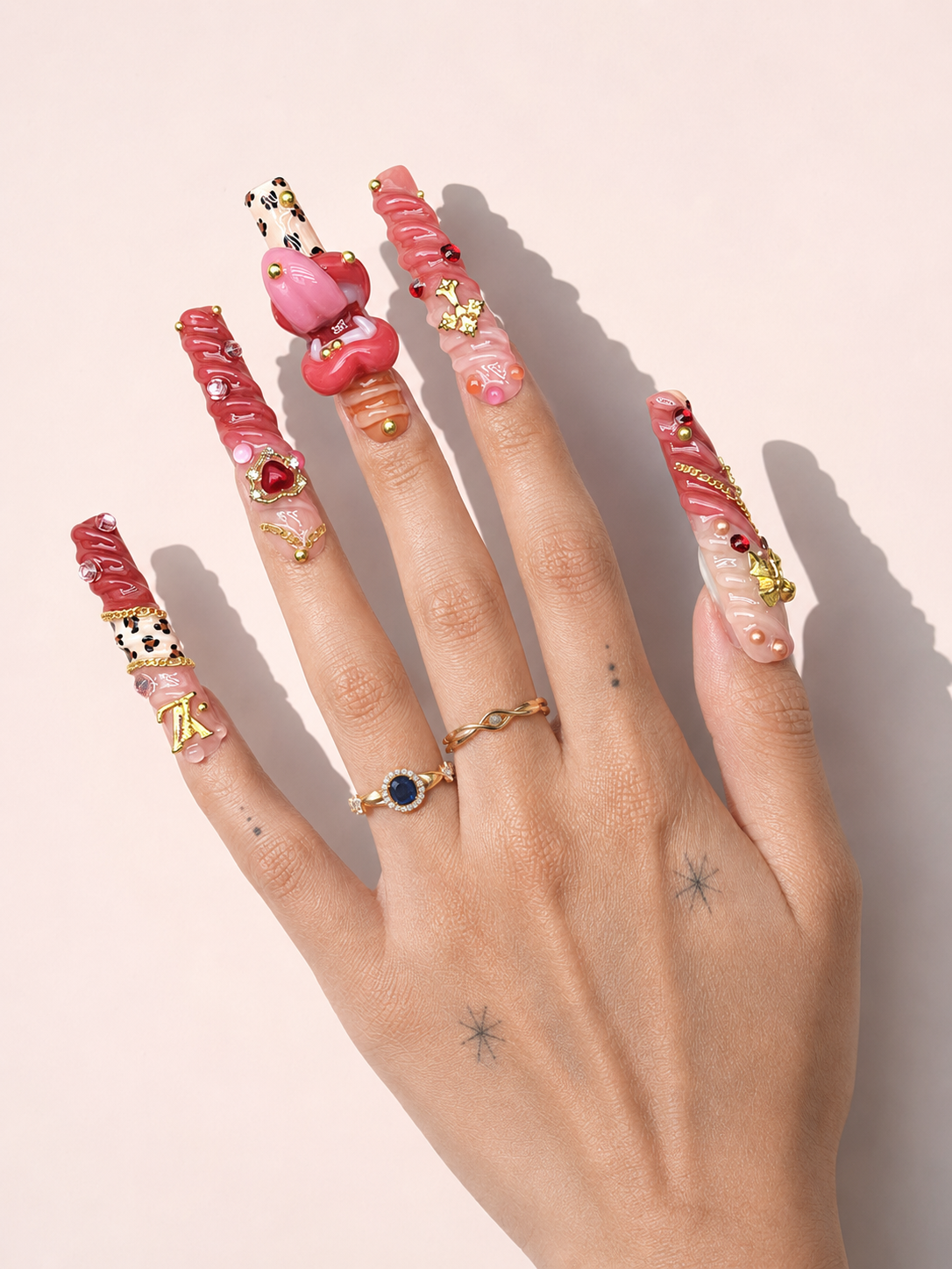 Scarlet Riot long square press-on nails worn on hand