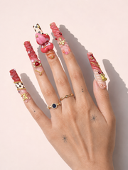 Scarlet Riot long square press-on nails worn on hand