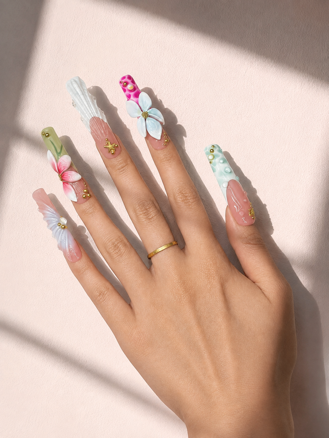 Seaside Bloom long square press-on nails worn on hand