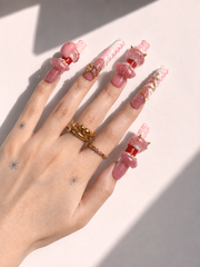 Pink Fang long square press-on nails worn on hand