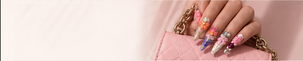 Colorful press-on nails holding a pink bag