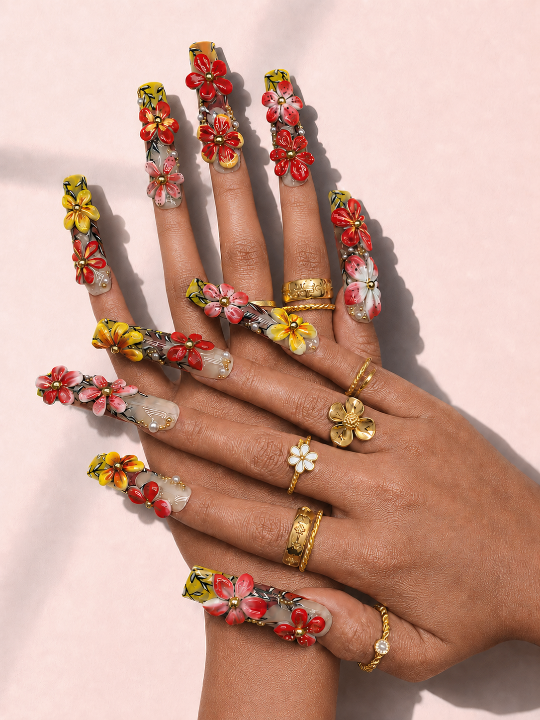 Solar Blossom long square press-on nails worn on hand
