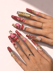 Scarlet Riot long square press-on nails worn on hand