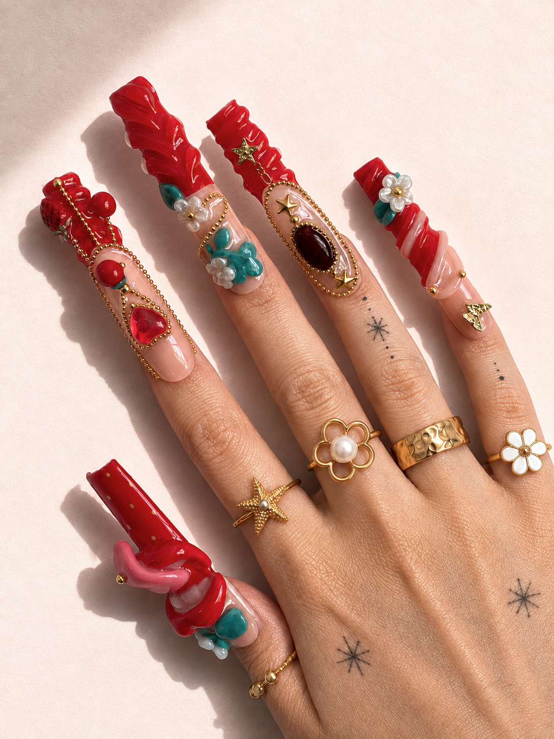 Ruby Tongue long square press-on nails worn on hand