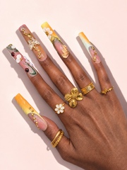 Honeyed Orbit long square press-on nails worn on hand